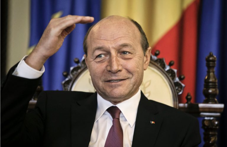 Romanian President Traian Basescu gestures during an interview with the Associated Press in Bucharest, Romania, Thursday, March 7, 2013. Romania's president says that the country should do more to tackle corruption if it wants to join the European Union's open border area, known as the Schengen Area. Basescu said that joining the so-called Schengen Area should become a national priority for the country of 19 million which joined the European Union in 2007. The Schengen Area is named after the town in Luxembourg where the open border agreement was signed. (AP Photo/Vadim Ghirda)