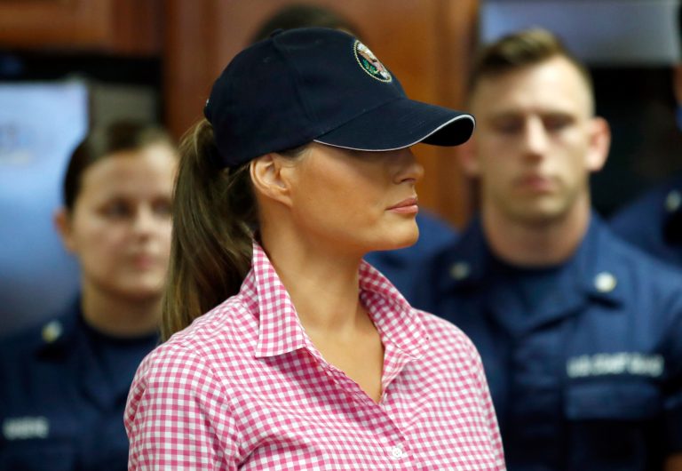 First lady Melania Trump listens as her husband, President Donald Trump, speaks to members of the U.S. Coast Guard at the Lake Worth Inlet Station, on Thanksgiving, Thursday, Nov. 23, 2017, in Riviera Beach, Fla. (AP Photo/Alex Brandon)