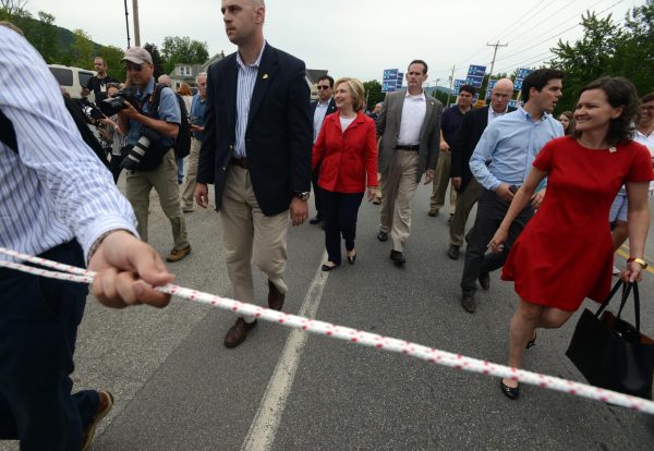 Clinton aides rope off media for parade