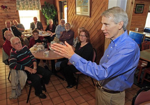 ISen. Rob Portman, R-Ohio, speaks to supporters at the Wayside Inn in West Union, Ohio, in May. Portman is often talked about as a potential vice president choice, but was absent from a bus tour through the state of Romney supporters this week. (AP Photo/Al Behrman)