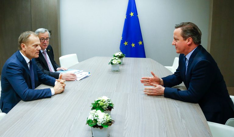 European Council President Donald Tusk, left, and European Commission President Jean-Claude Juncker, second left, participate in a meeting with British Prime Minister David Cameron during an EU summit in Brussels on Feb. 19, 2016. (Yves Herman, Pool Photo via AP)
