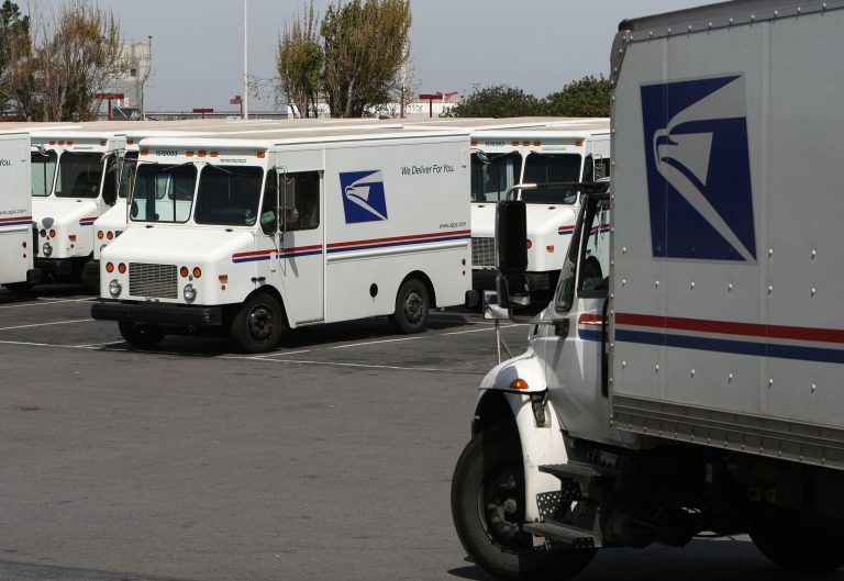 A truck drives out of the delivery dock at the U.S. Post Office sort center March 25, 2009 in San Francisco.Â White House budgeteers want federal agencies to consider the costs of climate change when they submit their fiscal 2017 spending plans.Â (Photo by Justin Sullivan/Getty Images)