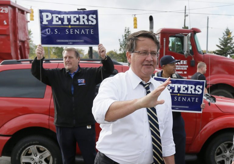 Michigan Democratic U.S. Senate candidate Gary Peters greets United Auto Workers at Chysler Group's Warren Truck Assembly plant in Warren, Mich., Tuesday. (AP/Carlos Osorio)