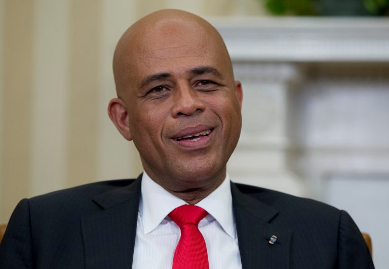 FILE - In this Feb. 6, 2014, file photo, Haitian President Michel Martelly speaks to the media during a photo opportunity with President Barack Obama in the Oval Office of the White House in Washington. Leading opposition factions alleged Thursday July 10, 2014, that Haiti's presidentially appointed electoral council is stacking the deck in favor of President Michel Martelly, who has scheduled long-delayed legislative and municipal elections for October. (AP Photo/Carolyn Kaster, File)