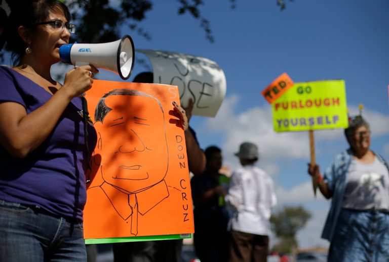 Government agencies may have furloughed employees and blocked access to public sites, but they haven't stopped spending money. (AP Photo)