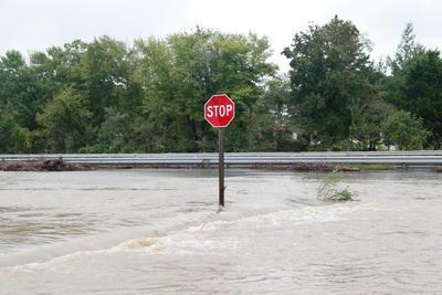 Flooding kills four, closes schools across region