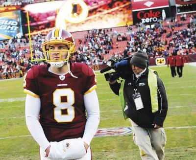 Quarterback Rex Grossman and the Washington Redskins nearly upset the 10-3 New England Patriots on Sunday, falling 34-27.