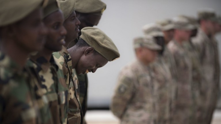 Soldiers from Somaliâs advanced infantry DANAB battalion await a certificate of completion after 14 weeks of training with the U.S. 10th Mountain division on the importance of logistical operation as well as the operation and maintenance of heavy equipment August 17, 2018.