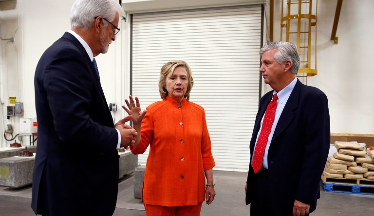 Democratic presidential candidate Hillary Clinton, center, speaks with Doug McCarron, president of the United Brotherhood of Carpenters and Joiners of America, left, and Bill Irwin Jr., executive director of the Carpenters International Training Center. (AP Photo/John Locher)