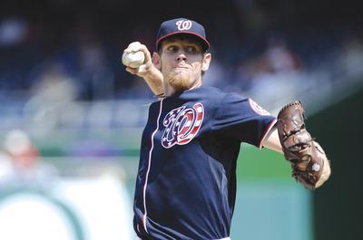 Greg Fiume/Getty Images
Stephen Strasburg, on a 70-pitch limit, threw three innings and retired six of the last seven batters while allowing one run vs. Houston.