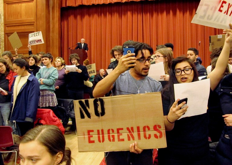 Middlebury College students turn their backs to Charles Murray, who they call a white nationalist, during his lecture in Middlebury, Vt., on Thursday. (AP Photo/Lisa Rathke)
