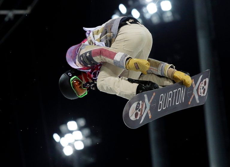 Shaun White of the United States gets air during a snowboard half pipe training session at the Rosa Khutor Extreme Park at the 2014 Winter Olympics, Monday, Feb. 10, 2014, in Krasnaya Polyana, Russia.  (AP Photo/Sergei Grits)