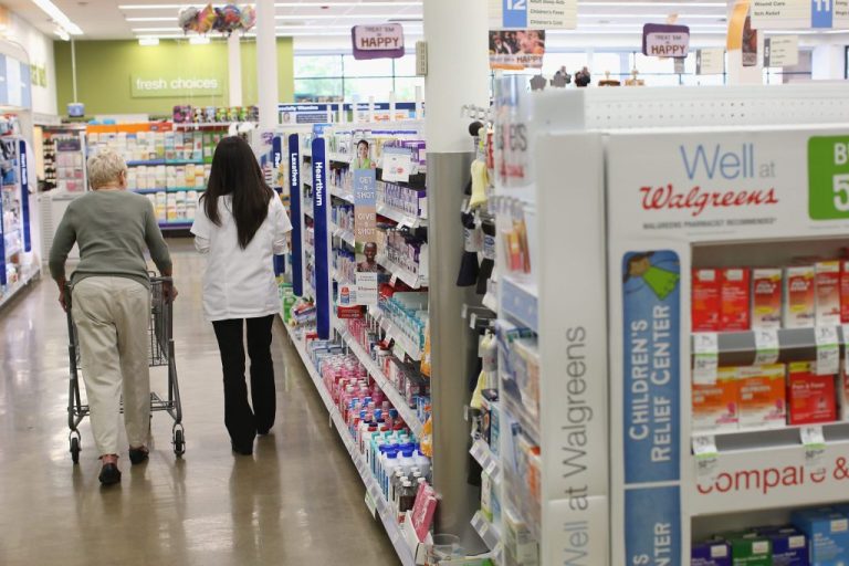 Pharmacist Jeanie Kim helps a customer.