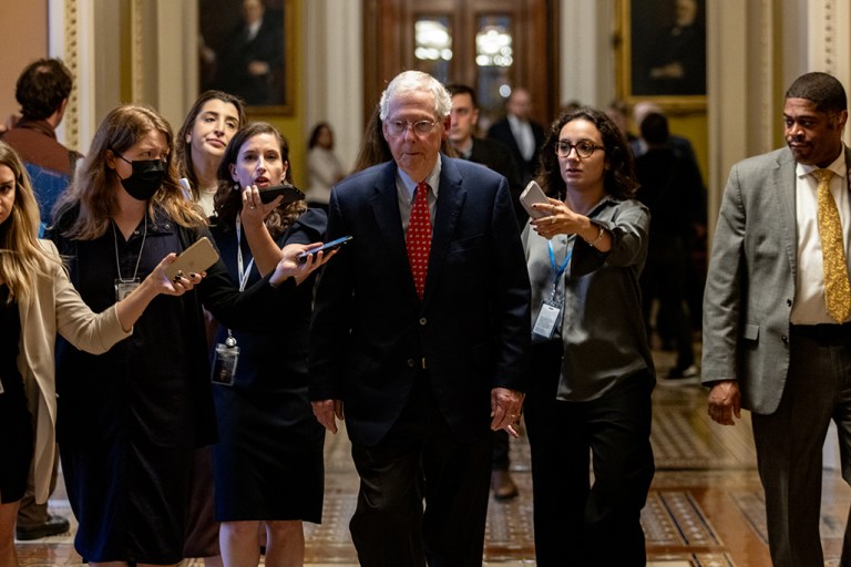 Senate Minority Leader Mitch McConnell (R-KY) fields questions from reporters as he walks to his Capitol Hill office on Sept. 28, 2023. While speaking on the floor, McConnell warned lawmakers of the consequences if the government shuts down, citing Border Patrol funding and security vulnerabilities. 