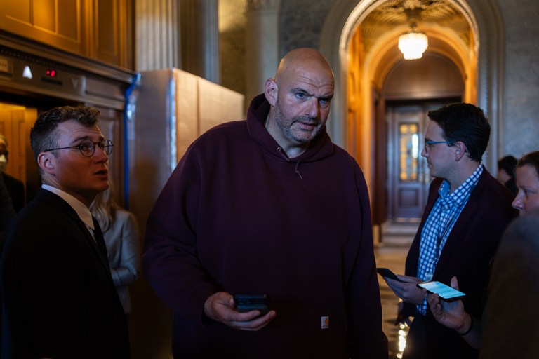 Sen. John Fetterman (D-PA), dressed in a hoodie, leaves the Senate chamber after casting a vote on Sept. 27, 2023. On Wednesday evening, the Senate passed a resolution to reverse an informal guidance from Senate Majority Leader Chuck Schumer (D-NY) that allowed senators to wear informal attire while on the Senate floor.