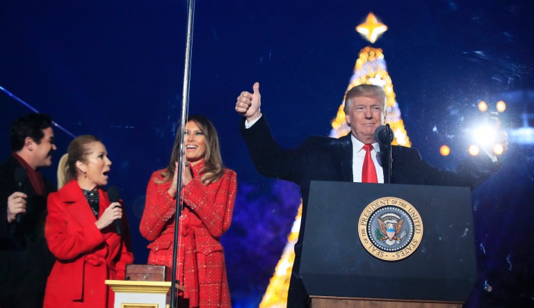 President Donald Trump and first lady Melania Trump, cheer after lighting the 2017 National Christmas Tree during the National Christmas Tree lighting ceremony at the Ellipse near the White House in Washington, Thursday, Nov. 30, 2017. With the president and the first lady are hosts for the event, Kathie Lee Gifford and actor Dean Cain. (AP Photo/Manuel Balce Ceneta)