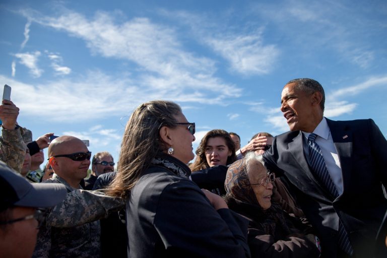 President Obama greets visitors after arriving at Elmendorf Air Force Base, Monday, Aug. 31, 2015, in Anchorage, Alaska. (AP Photo/Andrew Harnik)