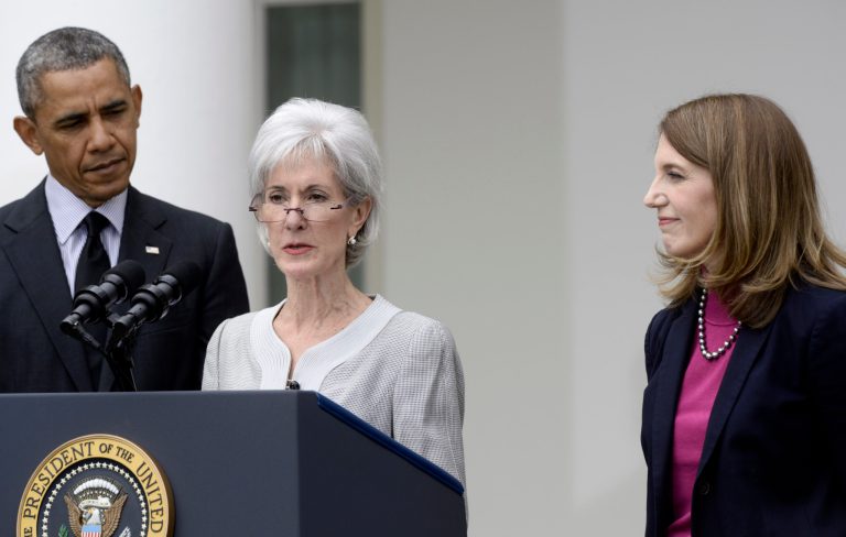 President Barack Obama and his nominee to become Health and Human Services secretary, Budget Director Sylvia Mathews Burwell, right, listen as outgoing HHS Secretary Kathleen Sebelius speaks in the Rose Garden of the White House in Washington, Friday, April 11, 2014, where the president made the announcment. (AP Photo/Susan Walsh)