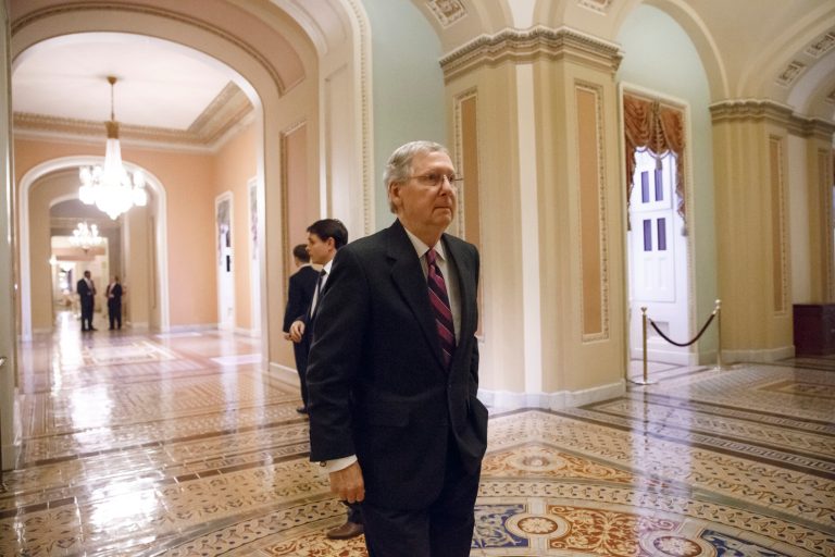 Senate Minority Leader Mitch McConnell, R-Ky., walks to the chamber for the final votes on the bipartisan budget deal designed to keep Congress from lurching from one fiscal crisis to the next and ease the harshest effects of the automatic budget cuts known as the sequester, at the Capitol in Washington, Wednesday, Dec. 18, 2013. (AP Photo/J. Scott Applewhite)
