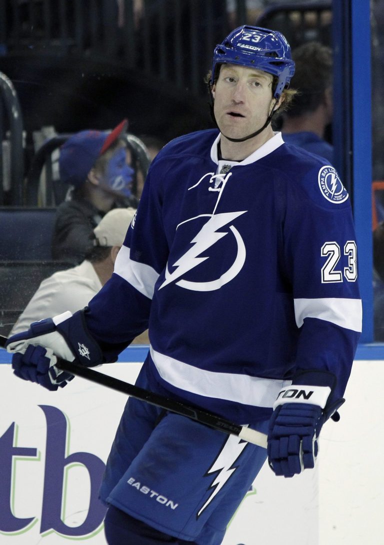   FILE - Tampa Bay Lightning defenseman Mike Commodore (23) during the third period of an NHL hockey game against the Montreal Canadiens in this Feb. 28, 2012 file photo taken in Tampa, Fla. Commodore, the 33-year-old player from Sherwood Park, Alberta, was among a long list of unrestricted NHL free agents who were left in limbo when the previous NHL collective bargaining agreement expired Sept. 15. He is now in his 13th pro season, and has played for almost as many teams in that span. (AP Photo/Chris O'Meara, File)  