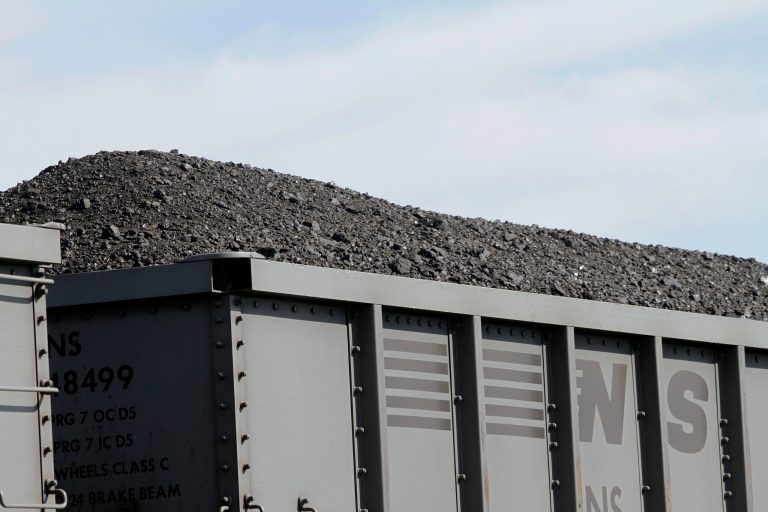 A Norfolk Southern Railroad train pulls transport cars full of coal near  Goodfield, Ill., on Oct. 9, 2012. The United States cut its energy-related carbon dioxide pollution by 3.8 percent in 2012, the second biggest drop since 1990, the Department of Energy said Monday, Oct. 21, 2013. Energy Department economist Perry Lindstrom said carbon pollution reduction is due to warm winter weather, more efficient cars because of new mileage requirements and an ongoing shift from coal-power to natural gas to produce electricity.  (AP Photo/Seth Perlman)