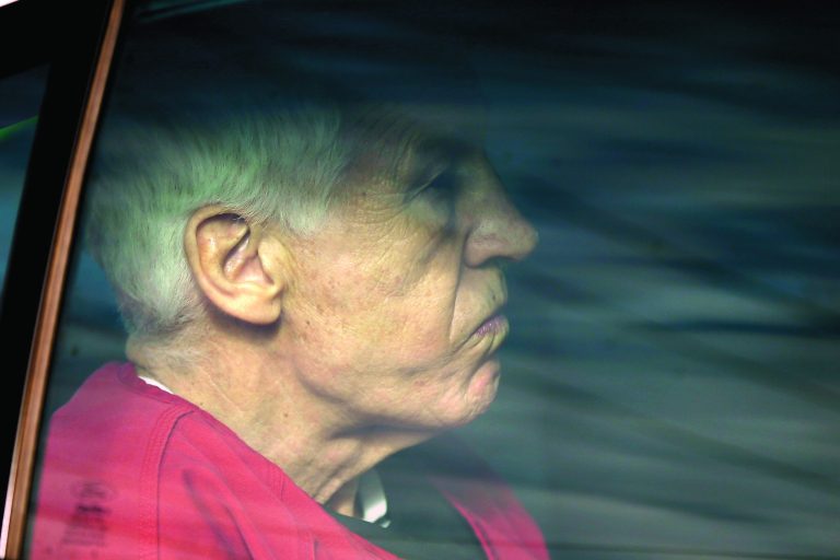 Former Penn State University assistant football coach Jerry Sandusky is driven from the Centre County Courthouse after being sentenced in Bellefonte, Pa., Tuesday, Oct. 9, 2012. Sandusky was sentenced to at least 30 years in prison, effectively a life sentence, in the child sexual abuse scandal that brought shame to Penn State and led to coach Joe Paterno's downfall. (AP Photo/Matt Rourke)