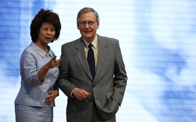 Minority Leader Mitch McConnell (R-KY) stands on stage with his wife, former U.S. Secretary of Labor Elaine Chao ahead of the Republican National Convention at the Tampa Bay Times Forum on August 26, 2012 in Tampa, Florida. The RNC is scheduled to convene on August 27 and will hold its first full-day session on August 28 as Tropical Storm Isaac threatens disruptions due to its proximity to the Florida peninsula. (Photo by Mark Wilson/Getty Images)