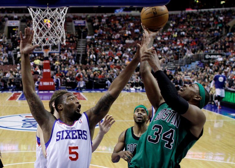   Boston Celtics' Paul Pierce, right, goes up for a shot as Philadelphia 76ers' Arnett Moultrie defends in the first half of an NBA basketball game, Friday, Dec. 7, 2012, in Philadelphia. (AP Photo/Matt Slocum)  