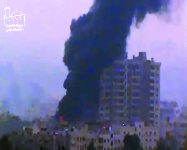 This image taken from video obtained from Ugarit News, which has been authenticated based on its contents and other AP reporting, shows smoke and fire billowing from an explosion in Damascus, Syria, Wednesday, Feb. 6, 2013. Heavy fighting erupted in Damascus Wednesday as government forces tried to hold back a new rebel effort to push the civil war into the heart of the Syrian capital, activists said.(AP Photo/Ugarit News via AP video)