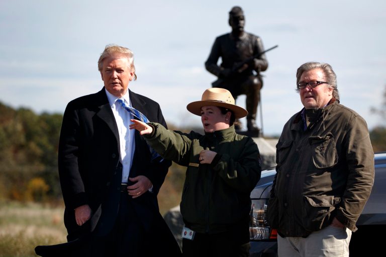 Interpretive park ranger Caitlin Kostic, center, gives a tour near the high-water mark of the Confederacy at Gettysburg National Military Park to Republican presidential candidate Donald Trump, left, and campaign CEO Steve Bannon, Saturday, Oct. 22, 2016, in Gettysburg, Pa. (AP Photo/ Evan Vucci)