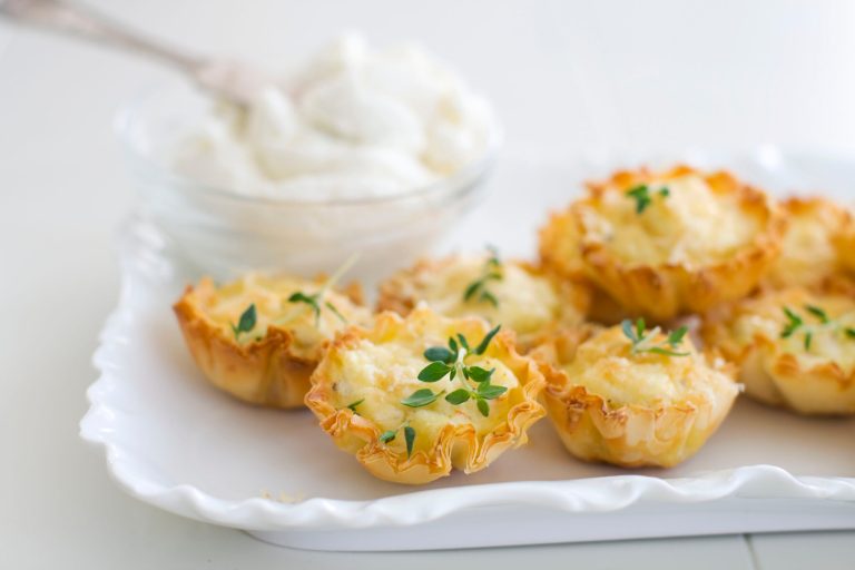   In this undated photo, ricotta cheese creates a rich and creamy base for crab bites perfect for a holiday party as shown served on a tray in Concord, N.H. (AP Photo/Matthew Mead)  