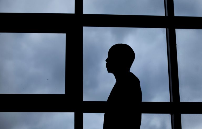 In this photo taken Thursday, Aug. 7, 2014, a 26-year-old gay Ugandan man, who insisted on anonymity because of fears for his safety, poses for a photograph after speaking to The Associated Press, in Nairobi, Kenya. When a Ugandan court overturned the country's Anti-Homosexuality Act this month, rights activists worldwide claimed a victory - but not gay Ugandans who fled persecution to live in a refugee camp in neighboring Kenya. (AP Photo/Ben Curtis)