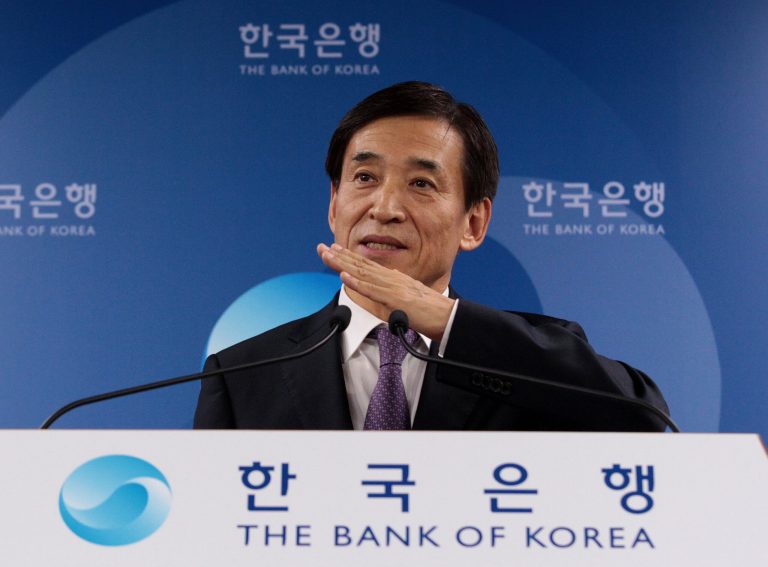 Governor of the Bank of Korea Lee Ju-yeol answers a reporter's question during a press conference on the benchmark interest rate at the bank's headquarters in Seoul, South Korea, Wednesday, Oct. 15, 2014. South Korea's central bank lowered its key interest rate to a record low Wednesday as it tries to bolster a fragile economic recovery. The bank also downgraded its growth forecasts for Asia's fourth-largest economy.(AP Photo/Ahn Young-joon)