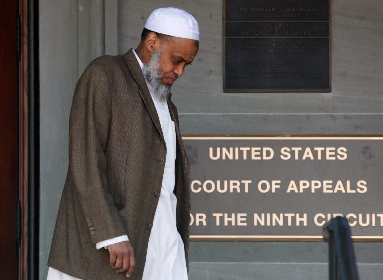 FILE - This May 11, 2012 file photo, Portland Imam Mohamed Sheikh Abdirahman Kariye, who is one of 15 men who say their rights were violated because they are on the U.S. government's no-fly list, leaves the United Sates Court of Appeals following oral arguments on the ACLU No Fly List challenge, in Portland, Ore. A federal judge has ruled Tuesday, June 24, 2014, that the U.S. government violated the rights of 13 people on its no-fly list by depriving them of their constitutional right to travel, and gave them no adequate way to challenge their placement on the list. (AP Photo/Rick Bowmer, File)