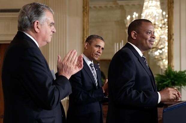 Charlotte Mayor Anthony Foxx, right, speaks after being introduced by President Obama as the nominee for Secretary of Transportation at the White House, next to outgoing Secretary Ray LaHood. Foxx was confirmed Thursday. Win McNamee/Getty Images.