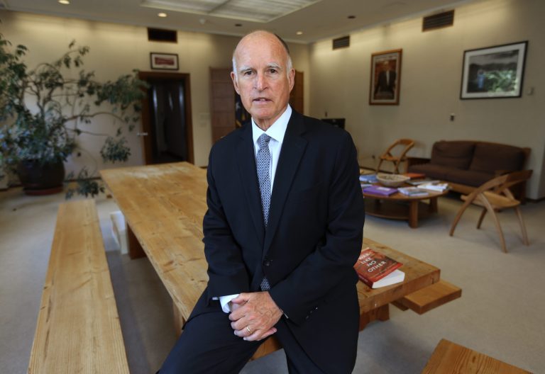 FILE  In this May 28, 2014, file photo, Gov. Jerry Brown poses in his Capitol office in Sacramento,Calif. Incumbent Brown faces Republican Neel Kashkari, a former U.S. Treasury official who has never held elective office, in the November election.(AP Photo/Rich Pedroncelli, file)