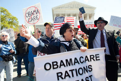 Protesters outside the Supreme Court during oral arguments in the health care case. (Graeme Jennings/Examiner file photo)