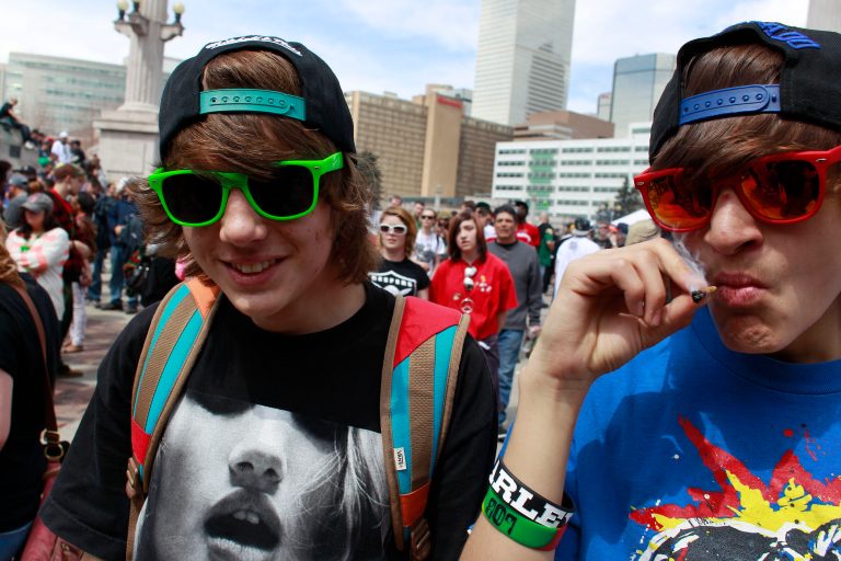 Youths smoke marijuana at aÂ Denver pro-marijuana rally at Civic Center Park in DenverÂ inÂ 2013. (AP Photo/Brennan Linsley)