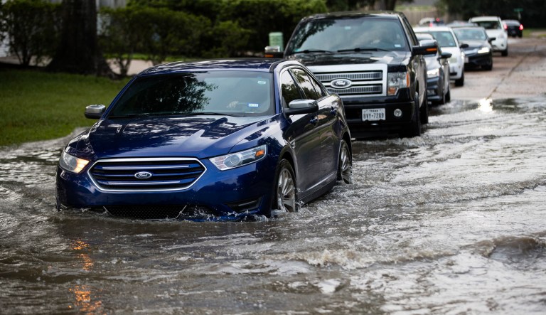 Vehicles drive on flooded streets in the aftermath of Hurricane Harvey on Wednesday in Houston. The campaign, announced by the Office of President George H.W. Bush, will premiere Thursday night with a public service announcement titled Our Friends in Texas on NBC during the NFL's opening game of the New England Patriots hosting the Kansas City Chiefs. (AP Photo/Matt Rourke)