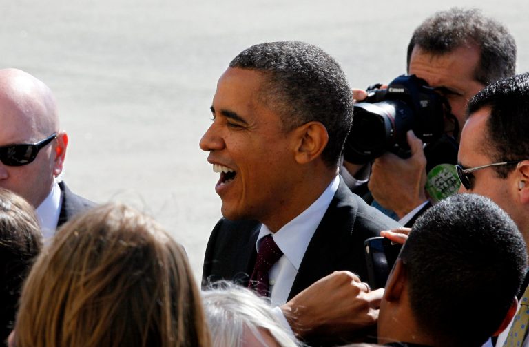 President Barack Obama greets well-wishers as he arrives at JFK International Airport in New York, Tuesday, Oct. 16, 2012, on his way to Hempstead, New York where he will participate in the second Presidential Debate at Hofstra University  (AP Photo/David Karp)