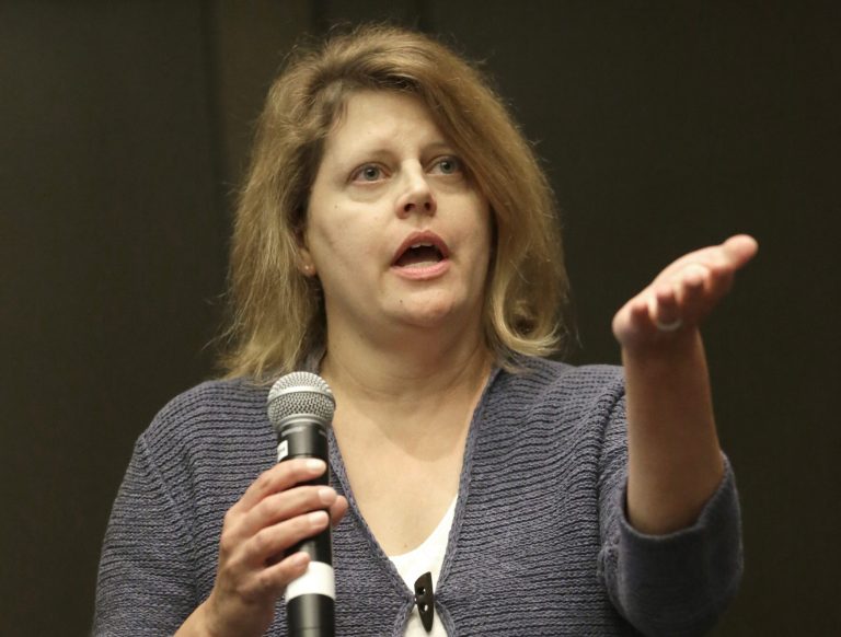 Sally Buzbee, Chief of Bureau for The Associated Press in Washington, D.C., responds to a question during a session of the APME conference dealing with media access from the local level to the White House, Wednesday, Sept. 17, 2014, in Chicago. (AP Photo/Charles Rex Arbogast)