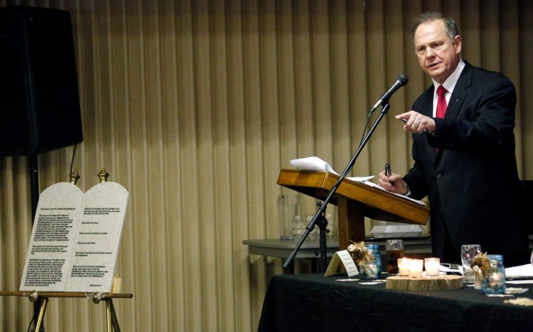 Chief Justice Roy Moore of the Alabama Supreme Court addresses a Pro-Life Mississippi and a Pastors for Life pastors luncheon in Jackson, Miss., Friday, Jan. 17, 2014. Moore told the attendees that he cannot separate his faith from his job as chief justice and continues to oppose abortion and same-sex marriage. (AP Photo/Rogelio V. Solis)