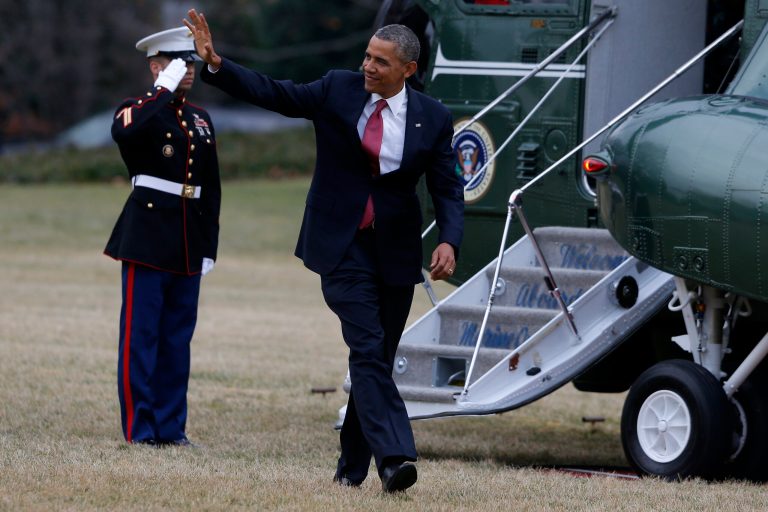 President Barack Obama waves after getting off the Marine One helicopter as he walks on the South Lawn of the White House in Washington, Wednesday, Jan. 15, 2014, as he returned from North Carolina where he spoke about the economy, jobs and manufacturing. (AP Photo/Charles Dharapak)