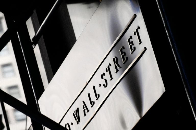 A sign for Wall St. is shown outside the New York Stock Exchange, Monday, July 15, 2013 in New York.  Most world stock markets fell Friday June 13, 2014 after poor U.S. retail sales data but benchmarks in China gained after an economic report bolstered optimism about the world's No. 2 economy. Oil prices pushed higher as an insurgency spiraled in Iraq. (AP Photo/Mark Lennihan)