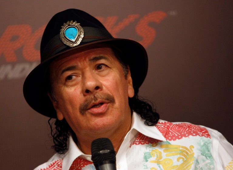   FILE - In this Oct. 27, 2012 file photo, musician Carlos Santana speaks during a news conference in New Delhi, India. Santana, Billy Joel, jazz artist Herbie Hancock and opera star Martina Arroyo, are the four musicians who will receive this yearâs Kennedy Center Honors, along with actress Shirley MacLaine. The Kennedy Center for the Performing Arts announced the selections Thursday. The honorees also include . (AP Photo/Tsering Topgyal, File)  