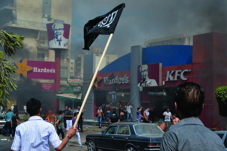 Lebanese protesters attack American fast food restaurants after Friday prayers, pouring petrol on the restaurants and setting them on fire in the northeastern city of Tripoli, Lebanon, Friday Sept. 14, 2012. According to security officials no one was hurt in the attack which is part of widespread anger across the Muslim world about a film ridiculing Islam's Prophet Muhammad. (AP Photo)