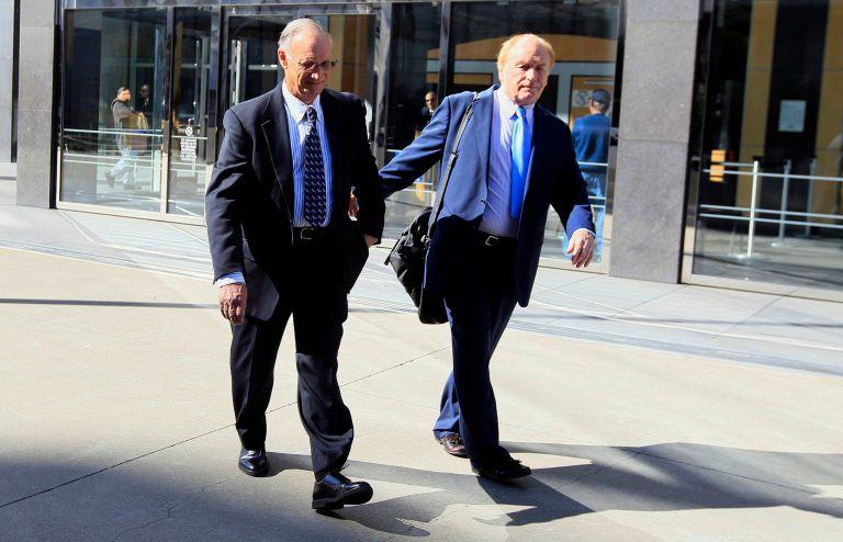 File - In this March 8, 2012, file photo, Robert Maegerle, left, walks out of a federal courthouse with attorney Jerome Froelich Jr. in San Francisco. Maegerle, a retired DuPont engineer, was convicted of economic espionage charges along with chemical engineer Walter Liew in March. Liew is facing more than 20 years in prison when he is sentenced Thursday, July 10, 2014, for a rare economic espionage conviction for selling technology for a white pigment to China. (AP Photo/Jeff Chiu, File)