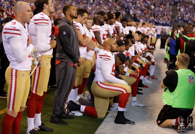 Members of the San Francisco 49ers kneel during the playing of the national anthem before an NFL football game against the Indianapolis Colts, Sunday, Oct. 8, 2017, in Indianapolis. Vice President Mike Pence left the 49ers-Colts game after about a dozen San Francisco players took a knee during the national anthem Sunday. (AP Photo/Michael Conroy)