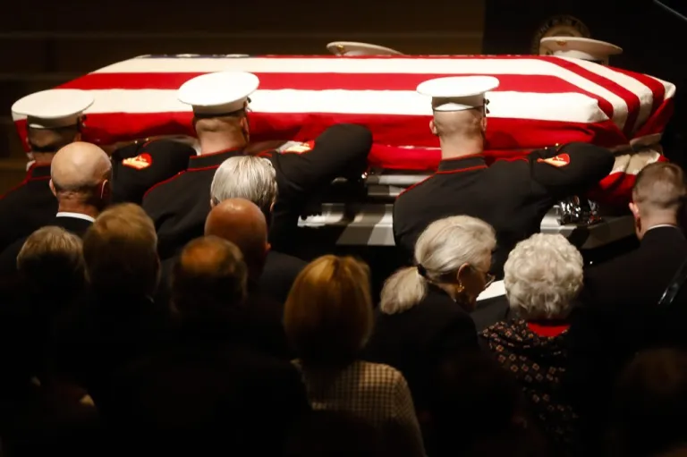 John Glenn's casket is carried by Marines into his funeral ceremony at The Ohio State University on Dec. 17 in Columbus. Glenn, the famed astronaut, died Dec. 8 at age 95. (AP Photo/John Minchillo)