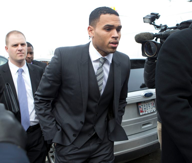 FILE - This Jan. 8, 2014 file photo shows singer Chris Brown arriving at the District of Columbia Superior Court in Washington. Lawyers for Brown are headed back to court in Washington, but the Grammy winner won't be there. Brown's trial on a misdemeanor assault charge is currently set for April 17. On Monday, his lawyers and a government prosecutor will be in court for a motions hearing. Brown's lawyers have asked a judge to dismiss the case, saying prosecutors misused the grand jury process to prepare for trial. They also want certain statements Brown made suppressed. (AP Photo/Manuel Balce Ceneta, File)